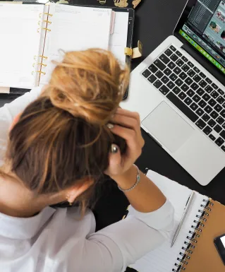 Woman Sitting in Front of Macbook