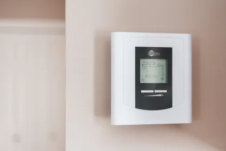 White Thermostat Hanging on the Wall