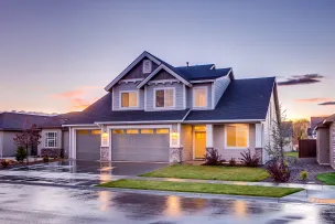 Blue and Gray Concrete House With Attic during Twilight