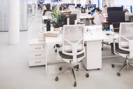 White Plastic Chairs and Tables in White Room