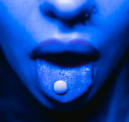 A Drug Tablet on a Person Mouth