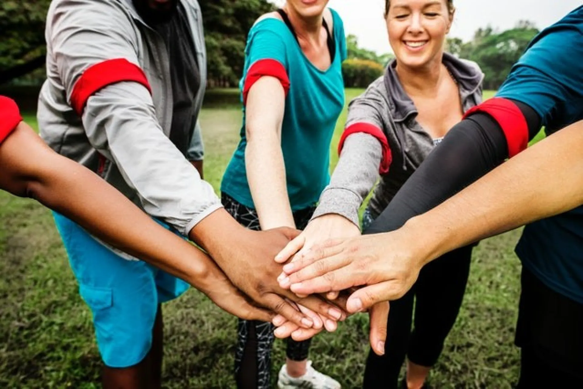 Hands together symbolizing team building at Clueless Escape Rooms in Ann Arbor - Your adventure awaits you - Book today!