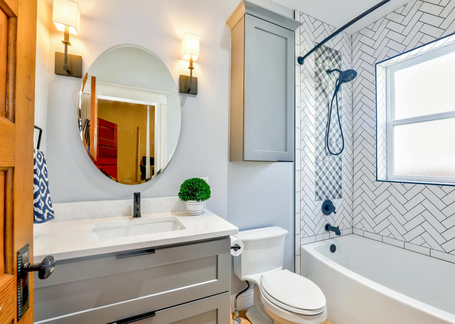 Oval Mirror Near Toilet Bowl