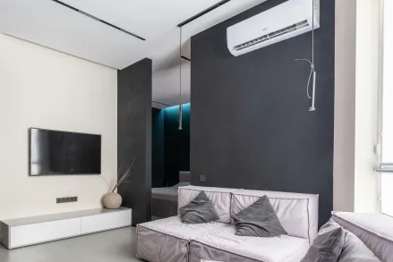 Cozy living room with sofas and television set