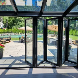 Glass door systems with folding glass door walls make a functional, flexible glass wall for dynamic use-changing seasons