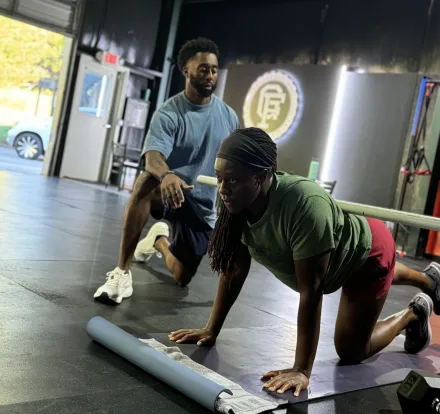 Man Touching Woman on Her Belly While Lying on Floor