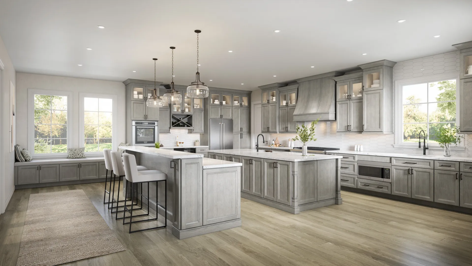 large open kitchen with bar stools, wooden floors and grey cabinets