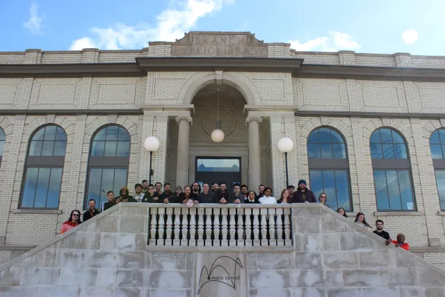 Full staff picture at the Macro Connect IT support building in Detroit, Michigan