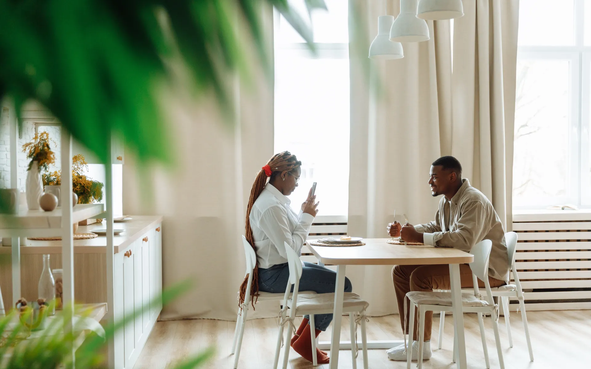 A Couple Having Breakfast While Taking Pictures