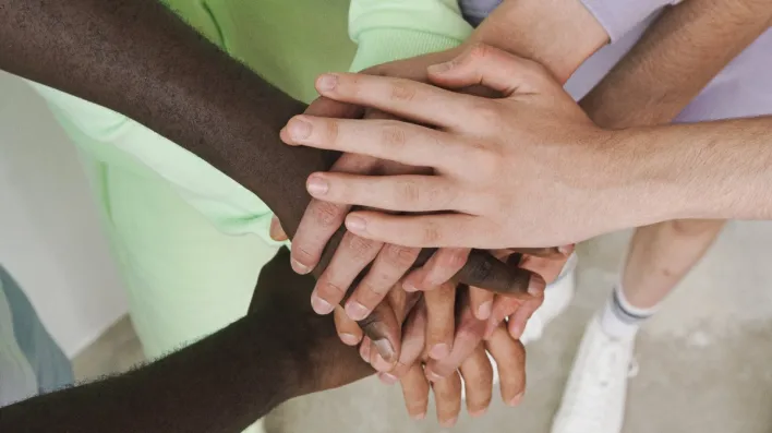 Group of People with Their Hands Together