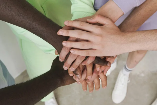 Group of People with Their Hands Together