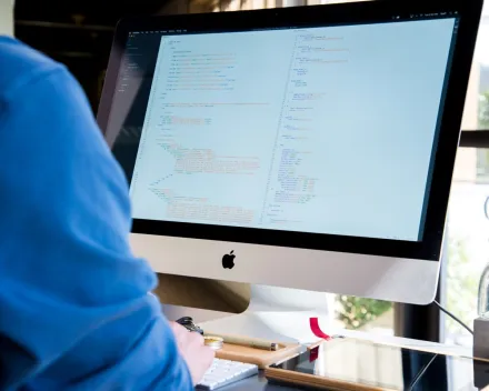 People Sitting on Chairs Beside their Desks in an office