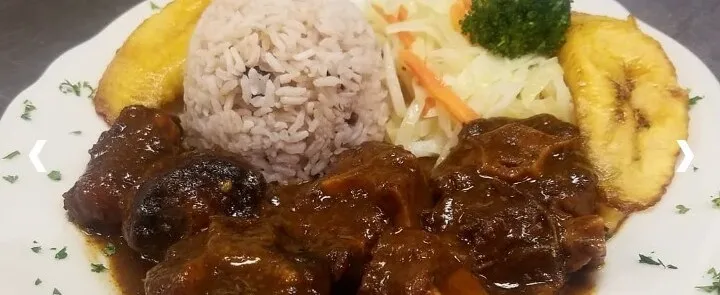 Cooked Food on Black Ceramic Plate