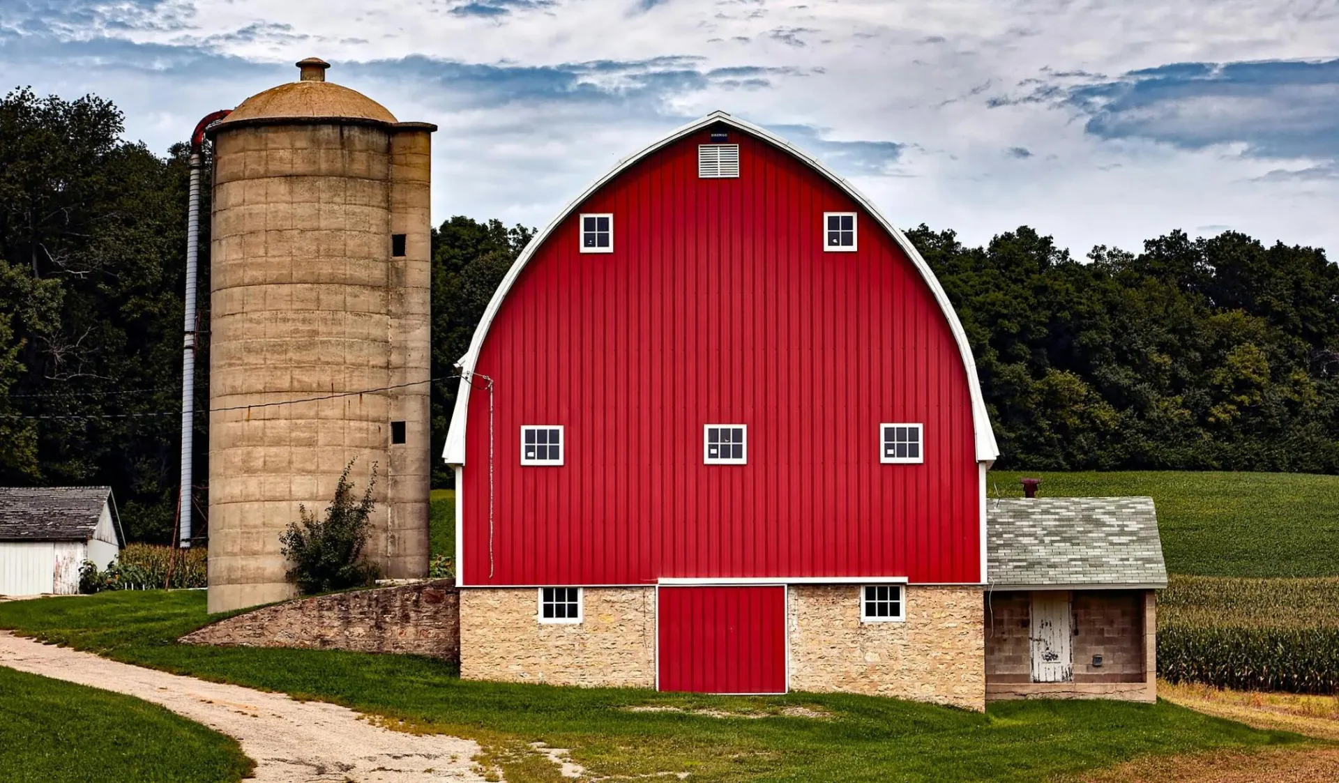 Picturesque red barn with silo in Cross Plains, WI, showcasing rural charm.