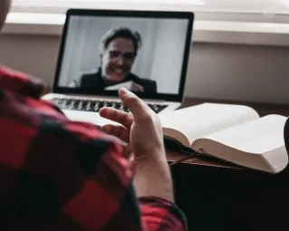 Man on the computer doing a telehealth visit