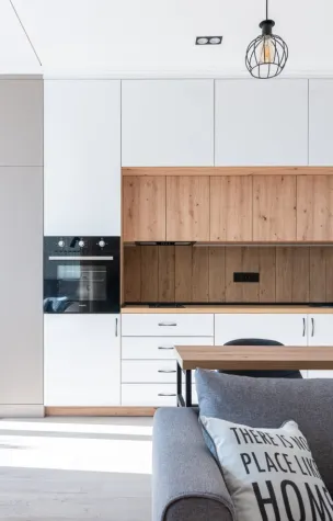 Room with open kitchen near sofa