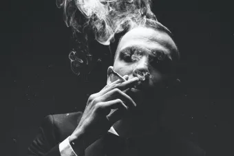 Grayscale Photo Of Man Smoking