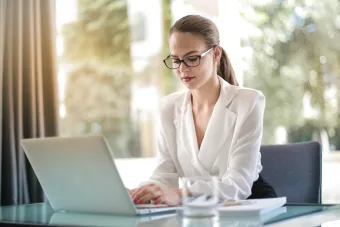 Women typing on laptop, editors, marketing professionals, RN health writer