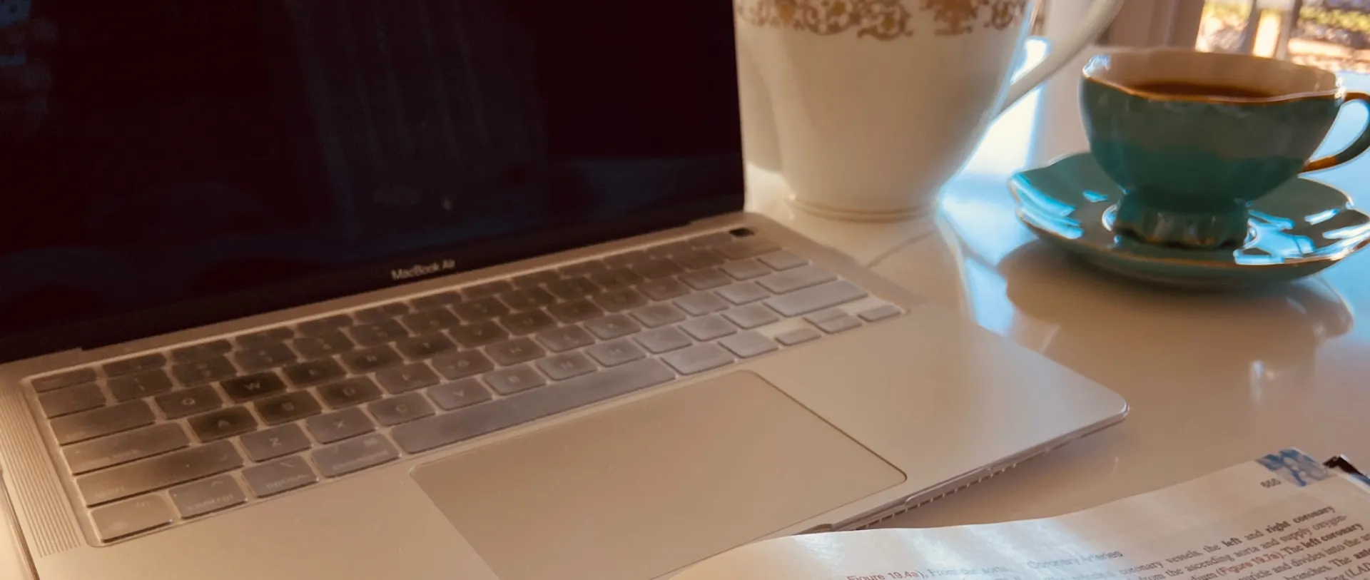 creating content, writing, typing on laptop, tea, health content creation, RN writer.