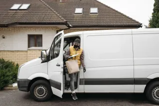 Man Delivering a Paper Bag