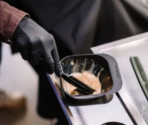 Person Holding Black Ceramic Bowl