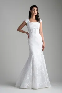 Modest fit and flare wedding dress in ivory brocade with ruching, exposed boning and cap sleeves