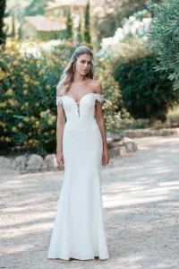Off-shoulder sheath gown with beaded, sequin lace appliqués across the illusion back and train