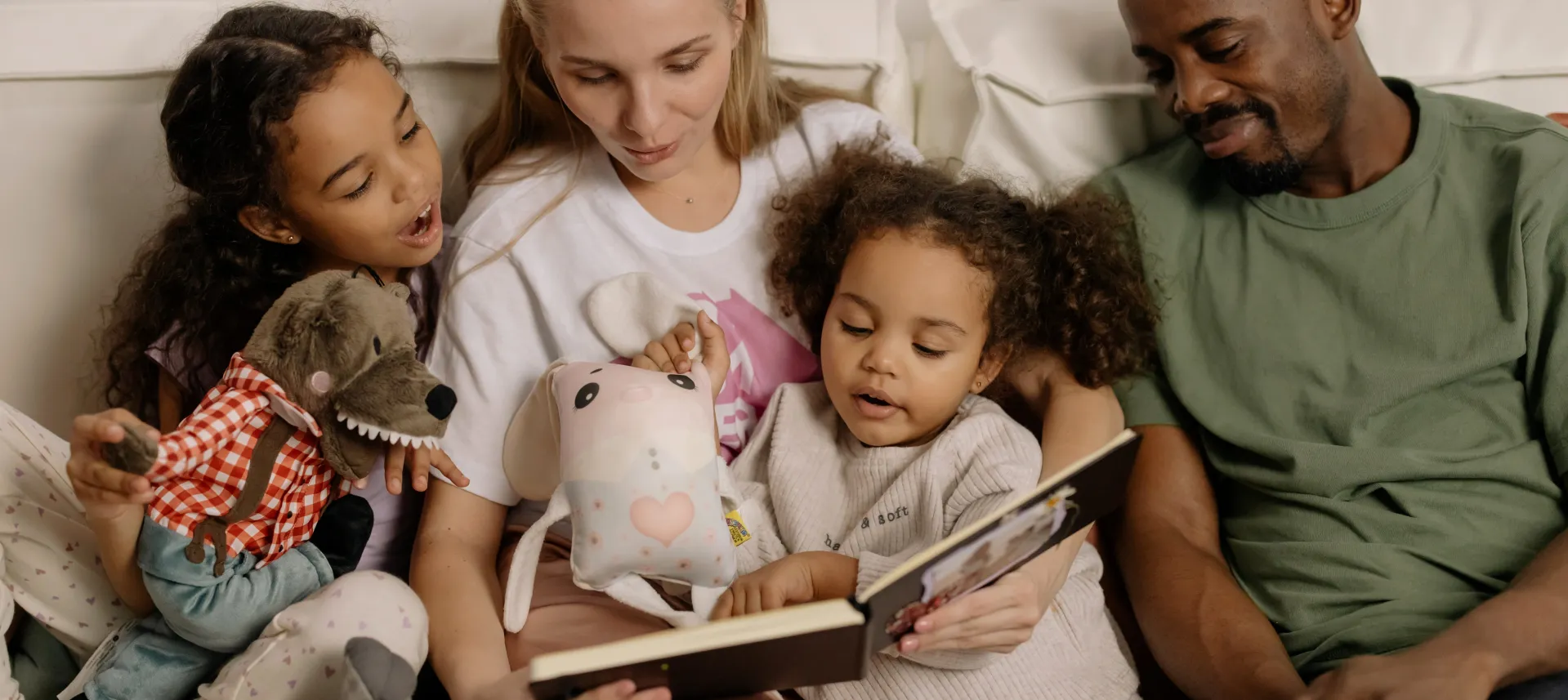 Photograph of a Family Looking at a Photo Album