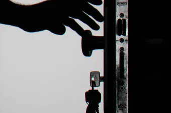 Silhouette Photo of Person Holding Door Knob