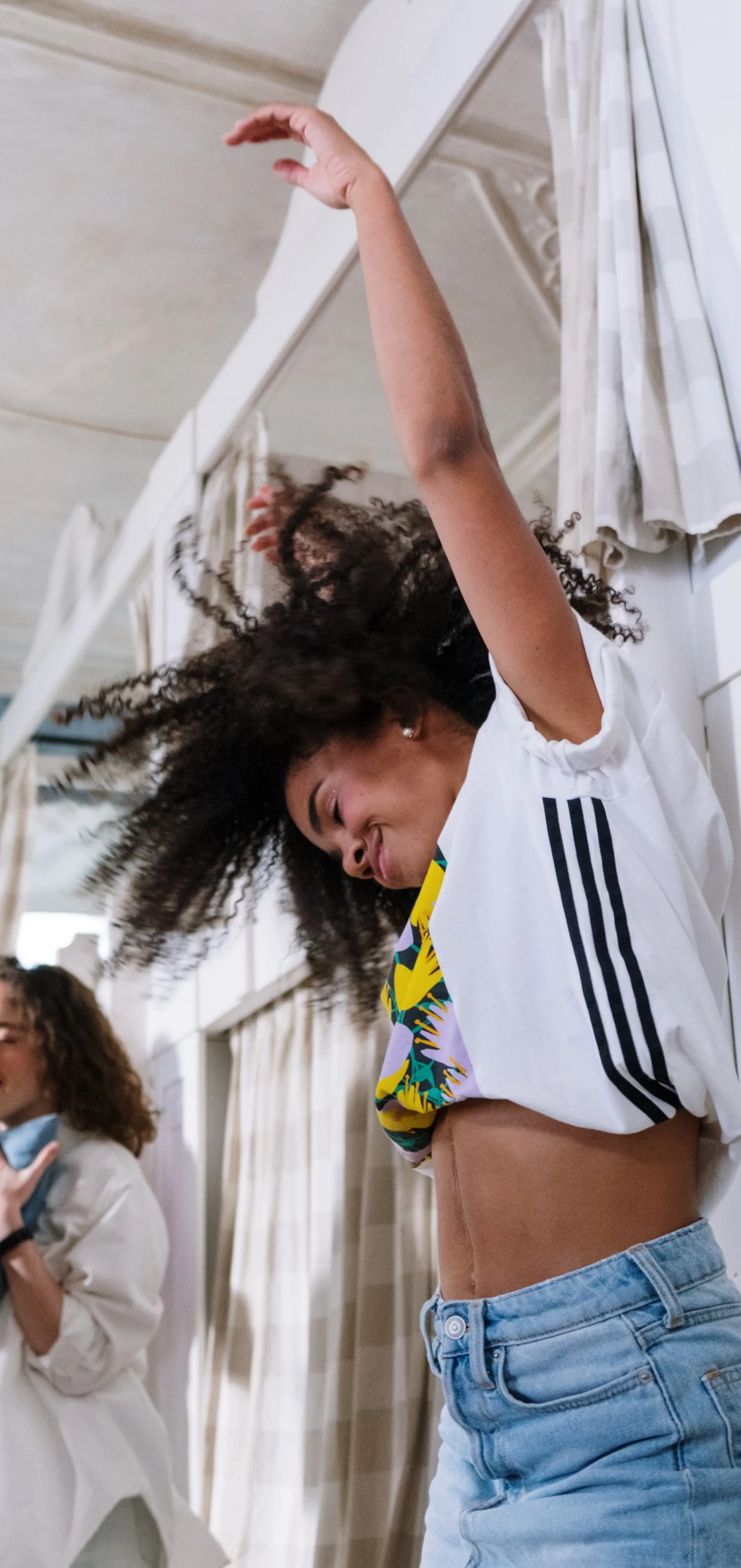Woman Dancing Beside a Bunk Bed