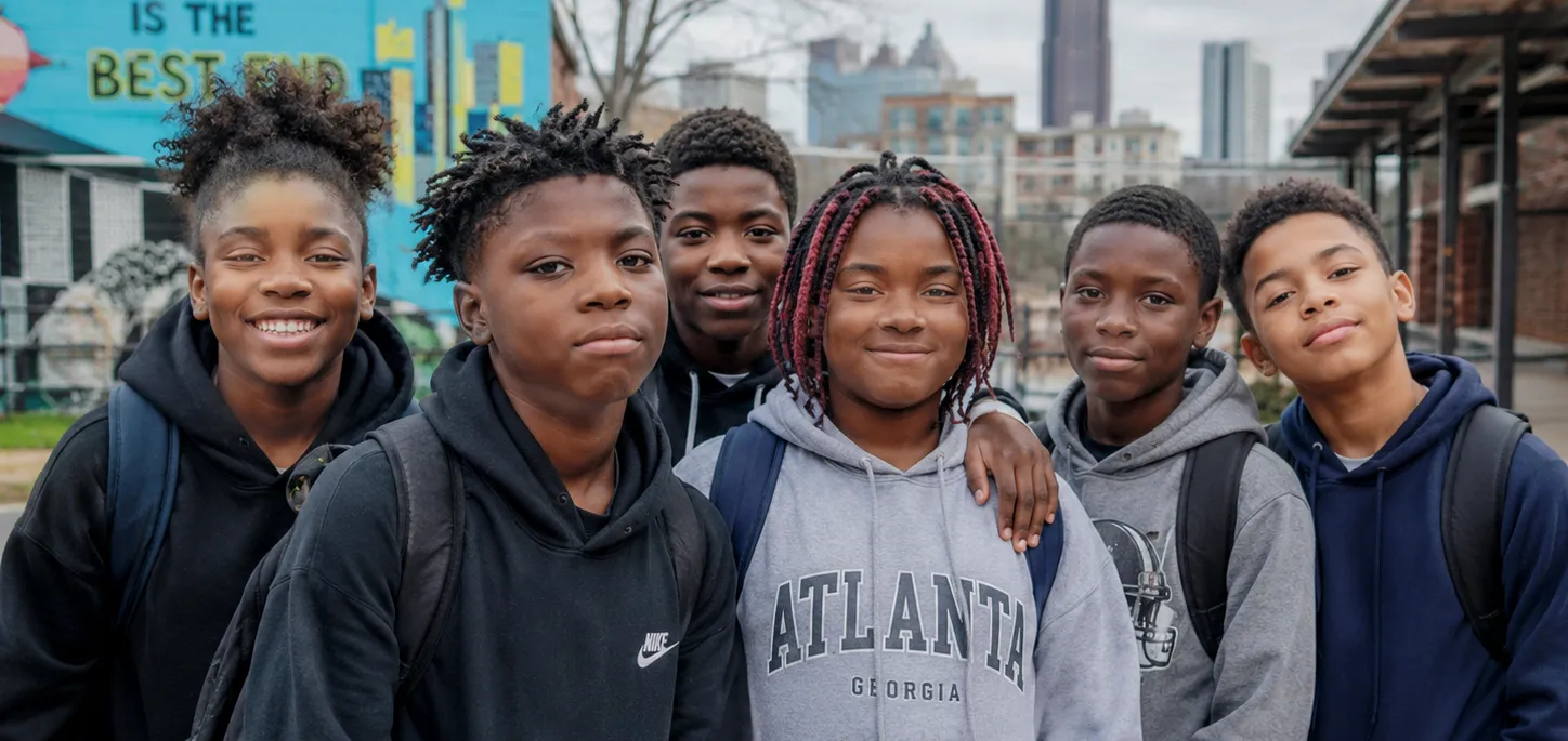 Atlanta youth standing with confidence, unity, and purpose in the heart of their community.