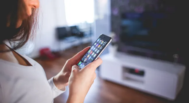 Woman Wearing White V Neck Shirt Using Space Gray Iphone 6