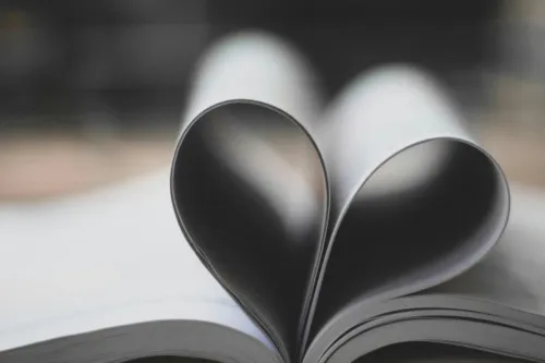 Closeup Photography of Book Page Folding Forming Heart