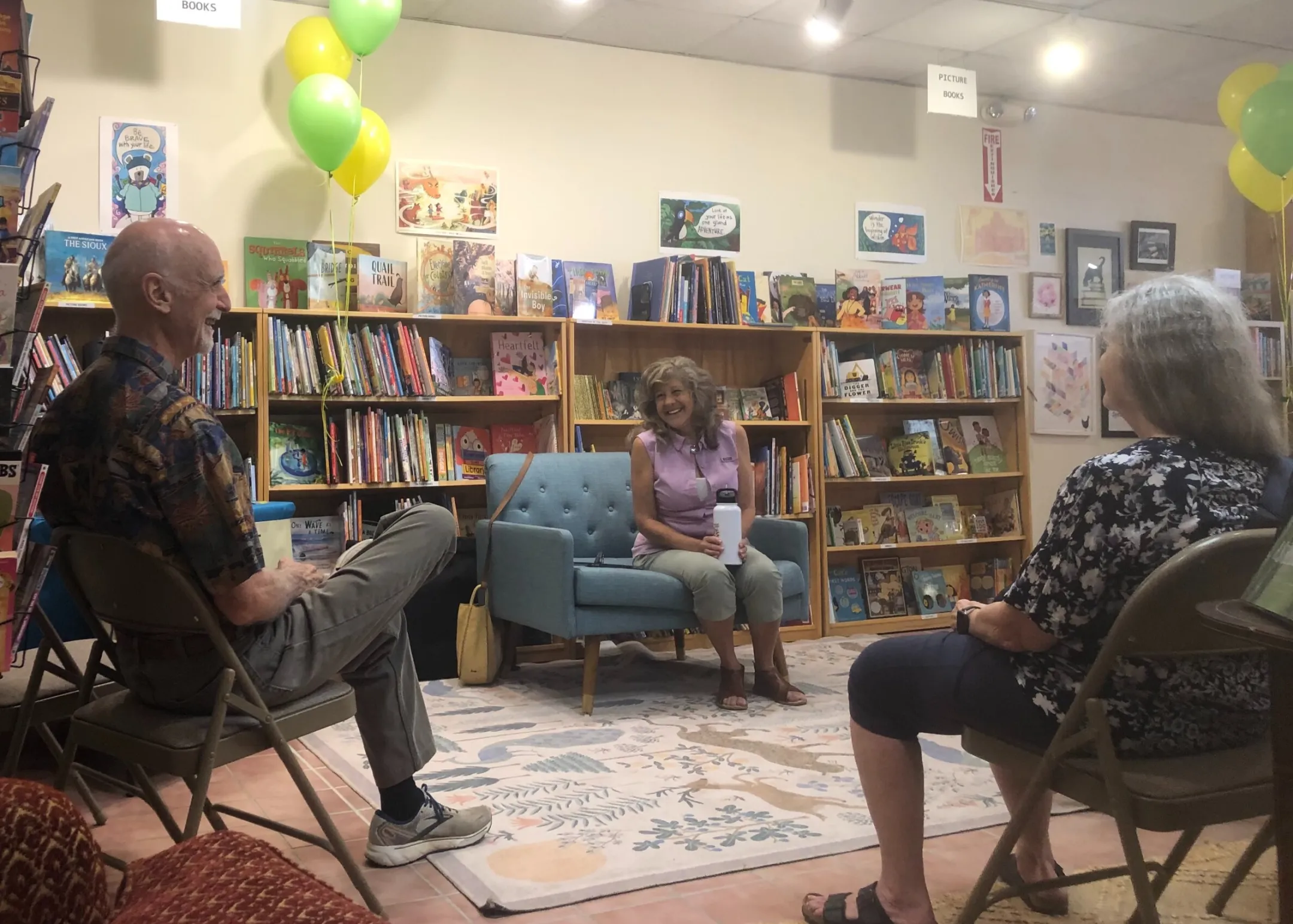 At book reading, John, Gail and a visitor, laughing