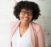 Woman Standing Near Whiteboard