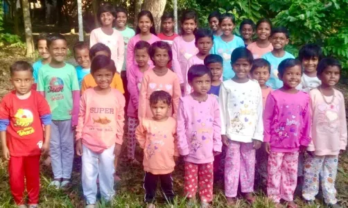 Village children receive new clothes at Christmas.