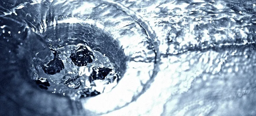 Water Flowing on White and Black Checked Bath Tub