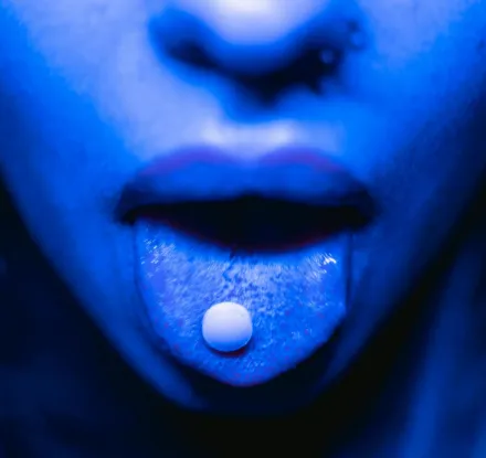 A Drug Tablet on a Person Mouth