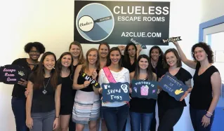 Ladies celebrating a bachelorette party after playing an escape room at Clueless Escape Rooms in Ann Arbor