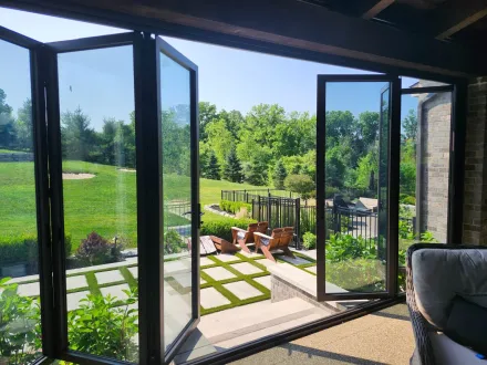 Reclaim space in more seasons and weather conditions with the addition of Michigan Folding Doors, glass wall improvement