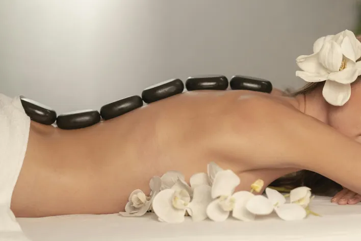Black Stones on Woman's Back
