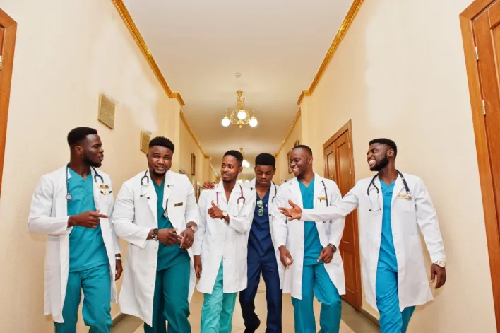 Crop doctor with stethoscope in hospital
