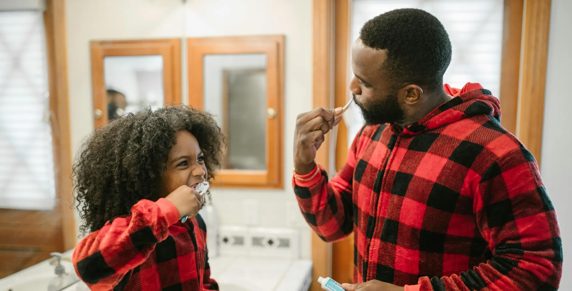 Father Guiding Child on Cleaning Teeth
