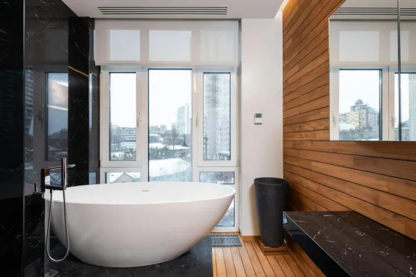 Modern bathroom interior with panoramic window designed by bathroom remodelers in Boynton Beach, FL