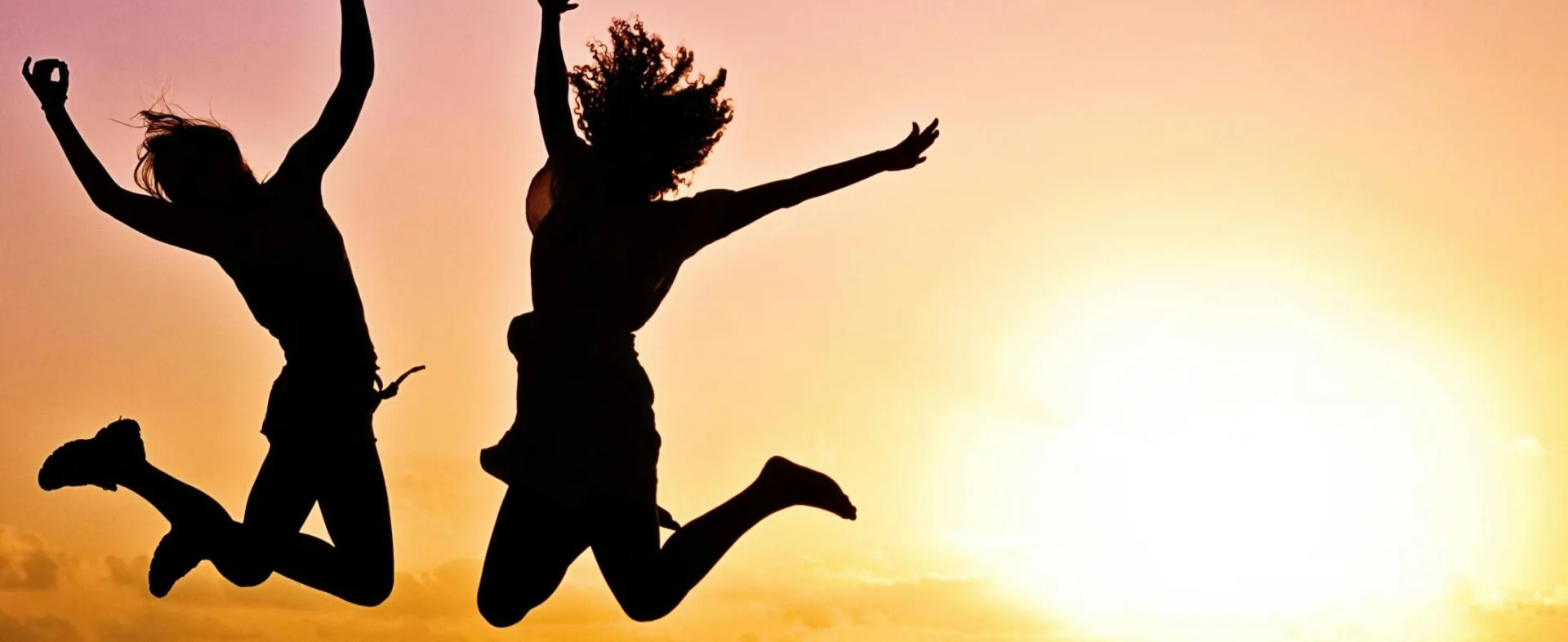 Silhouette Photography Of Jump Shot Of Two Persons