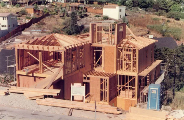 Framing in progress of hillside home designed by Robert Meckauer replacing house lost in Oakland Firestorm