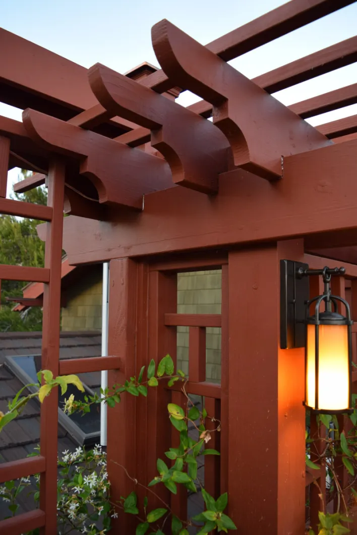 Detail of finished custom deck trellis designed by Robert to match the Craftsman styling of the existing home