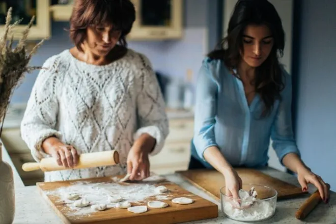 A heartwarming moment depicting a joyful interaction between a Pop In Concierge and a client wanting to bake.