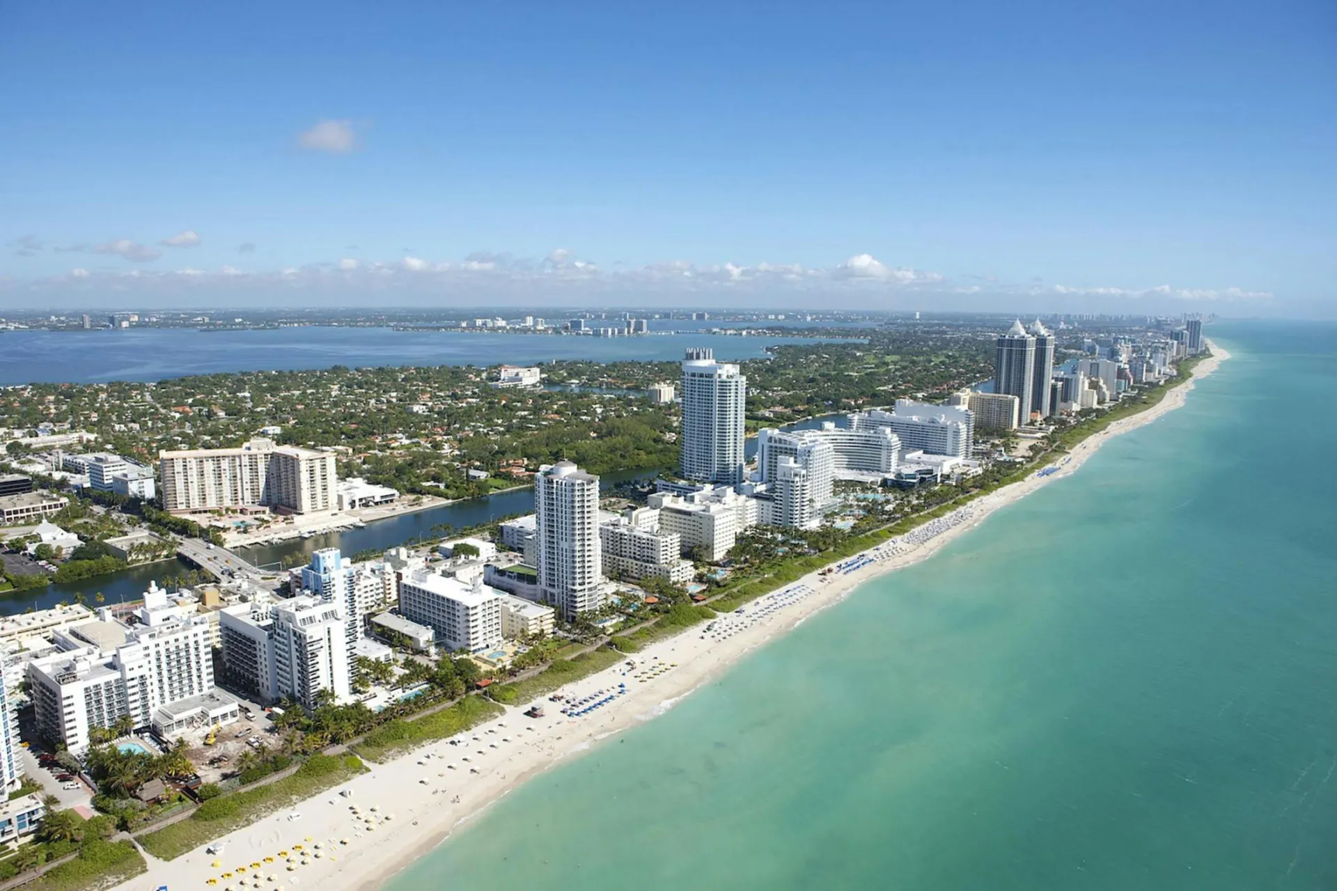 Stunning aerial view of Miami Beach's skyline along the Atlantic Ocean, ideal for travel and adventure imagery.