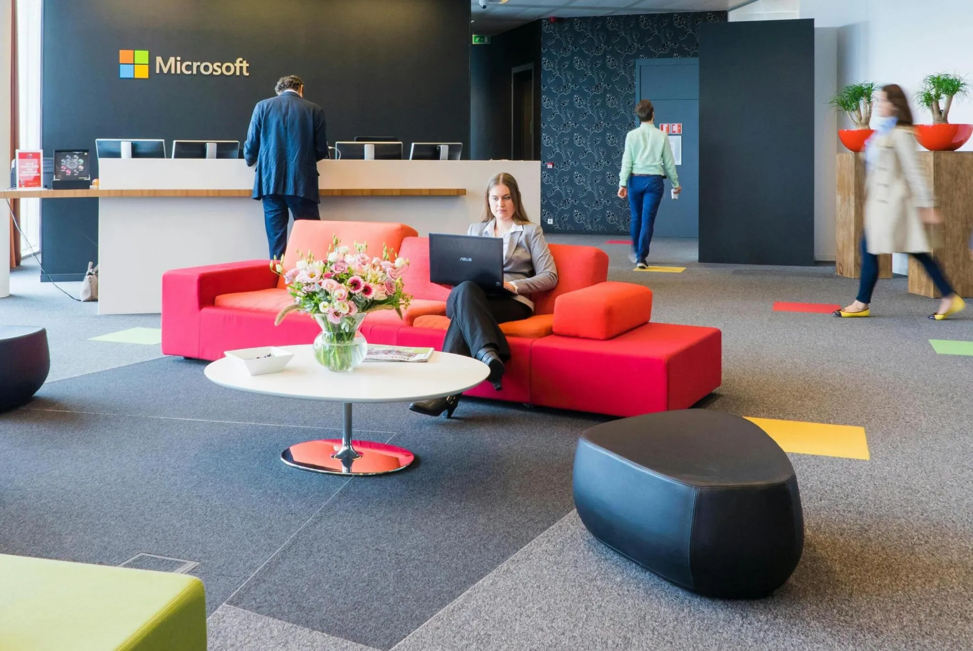 Contemporary office reception area with vibrant seating and professional ambiance.